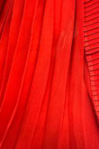 The dress just arrived 5 minutes ago. When I took it out the package, there was loose threading in several areas. It's a pretty dress, but the stitching doesn't seem very secure, which is disappointing for a brand-new item. I was hoping for better quality. - Desha T.
