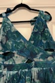 As with all the other reviews, my issue is with the design of the top. The crisscross feature is cute in theory, but it's a wardrobe malfunction waiting to happen - no matter your bra size! I opted to have a seamstress sew it closed for $25 because there were enough reasons to keep it. I know all the other reviews say this, but I want Lulus to understand how crazy this design is. You've been forewarned! - Farrell B.