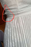 It fit well everywhere, except where it doesn't! Ruches so awkwardly in the back/sides. It looks fine on the model but IRL, it is not it. I know I have some back fat but it just lays awkwardly. it has no problem zipping and then there's these weird gaps. Everything else is good, color is accurate, floral design is gorgeous, but this one detail makes me want to return. - Meghan S.