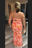I was super happy with the fit, the length and how flattering it was, especially with the way it bunched around the midsection to hide the tummy. The material was perfect for an out-of-town event travelled very well in a suitcase. - Angel A.