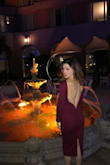 I bought this dress to wear for my birthday and I'm glad I did. This is exactly what I was looking for, something sexy yet classy. The material is a perfect wine color and it is thick enough not to have to wear a bra. . even sexier! The zipper on the side did not contour to my waist and ended up sticking slightly out but it didn't bother me. Whatever you do, do not wash this dress in washing machine or dryer. When I did the metal supports in the back ended up popping out. - Michelle W.