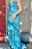 This dress runs true to the size chart. Normally a medium but bought this in a large. The strap broke during prom but was able to tie it up. low cut and a good bit flows on the ground. Beautiful color. - Jennifer D.