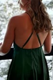 I wore this to a winter wedding. The fabric has a luxurious sheen and is lined. The high neck and open back flattered my small chest. Easy to dance the night away! Though I did need heels otherwise it dragged. - Crystal L.