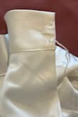 It is a stunning dress! The shape and material are beautiful, and it gives a classy look. However, both buttons popped off very quickly during my first wear. In addition, the stitches on the bottom were unfinished, making the dress look cheap. - Vic N.