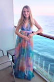 Hands down the most gorgeous dress I have ever worn. The colours are absolutely stunning and looks beautiful in so many different lights. The fit worked well for me. It's very long so wore my highest heels and it was the perfect length. 

I wore this dress without a bra - because the front cut is just so low it showed even the most discreet strapless bra. 

I wore this on the formal night of our cruise holiday and got so many compliments ! It's so unusual and really stands out as an evening dress. 

Would highly recommend buying - it's individuality is worth the price - and if you love colour, this is the dress ! - Sarah P.