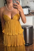 at first, I got a size small and it did not fit well in the bust. The sides like by my armpit were loose, and it wasn't holding my girls in very well. But the size xs was way better. I think it might be a little too much in the chest for some, it was almost showing too much for me, but I'm just gonna roll with it. One thing though, is that it is definitely too long. I'm 5'3 and half of the bottom tier drags even with heels, so I'm just going to cut it off so it fits right. It fits great, very loose and comfortable, but still snug in the bust, so I don't have to worry about a potential slip. - Jenni L.