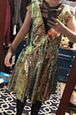 I ordered a medium and the dress literally hangs off me, it's huge and it seems like there's just a lot of extra material in the skirt part that just bunches together, sequins falling off of it everywhere, very itchy. - Ren O.