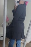 It's cute, true to size, no stretch, unlined, kinda like a work trouser fabric, thin n lightweight, and true to size. Bought this for chill night out in spring n fall. Pair nicely with my jeans. There's enough room to wear your light long-sleeved sweaters. Overall, for how much, I'm happy and will make it work. - Peggyan L.