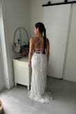 This is the dress I chose for my wedding. I feel it provided everything I liked. It has a beautiful lace corset-like top with a low back and a fitted design. Very comfortable and easy to walk with. Has a short trim which makes it very elegant. - Claudia V.
