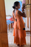 This dress was so pretty when I tried it on. Other reviews are right when they say that it's a little tighter across the rib cage area (where the band of ruching is). It was not bothersome to me, even though I have a wider rib cage. It was definitely snug, but not uncomfortable by any means. Also, if you are shorter like me, the dress will come down lower than it does on the models. Overall, the dress was a top choice for me to wear for a wedding, but I ultimately went with a different one, but not because anything was wrong with this dress! - Alyssa K.