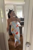 When I saw the photo of this dress, I immediately envisioned Audrey Hepburn style. I am obsessed with it. I bought it in S and M bc I'm in a crunch with the event and needed to make sure it fit. I'm still waiting for the small to come to compare, but the medium fits great. I usually order dresses in a small, but glad I ordered the medium. The corset style tie is the best feature as I can tighten it as much as I want and the top stays perfectly. I love the silky smooth feel of it. It's giving structured elegance with a summer vibe. - Christine M.