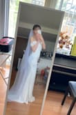 The cut is very flattering, and the dress is elegant! But I personally think the layers at the back seem a bit too busy. And it runs small. I really love how it looks at the front though! - Ke-Chun Y.