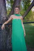Color of this dress is stunning. I loved the pleated and elegant feel to it and received so many compliments on this. There's that nice sticky seam on the bust area, so I didn't notice it sliding down all that much on the dance floor! It does run long, but I'd rather that than too short- always. - Alana S.