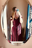 This dress hugged in all the right places. I'm very tall and the length just touched the floor! I sized up to a large to accommodate my chest but I feel like I could have also fit a medium. - Kaitlin N.