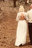 This dress was worn for my outside wedding and it was so pretty. I needed my shoulders / length / sleeves adjusted after ordering a medium and not having enough time to order a small. I'm 6.5 months preggo so thought I'd need to order up, but in my "normal" size I would need an xs I suppose. - Brittany H.
