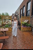 Loved this jumpsuit. Had to exchange for an XS even though normally I'm a small/medium. The XS fit super well although the top part was slightly uncomfortable because of the lining. Worth it though! - Hannah H.