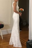 I ordered this dress as a potential wedding dress. My bridesmaids and I loved the front of the dress. The straps are very elegant and shows off your collar bone nicely. The deep V looks very nice as well with the mesh. The fit is amazing, even the length is perfect with heels. Cons: the back is kind of meh but can be altered, the mesh in the front isn't sewn on straight, not sure if it's just the one I got or if it's an issue across the board. - Wendan L.