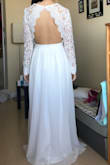 Ordered this dress as a potential wedding dress but it ended up too casual and a little too boho for me. The top was also large on me, the sleeves are too long and loose as well. I did like the scalloped edge in the front and the open back and the skirt was nice and flowy. - Wendan L.
