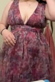 It's super cute when styled. It definitely fits very small. I typically wear a L-XL and needed to purchase the XXL. The color is a bit darker in person than in the photo, but still cute. Would love if the band for the waist was thicker to have a more flattering shape. It is very very long, so if you're short, you'll need heels or alterations. I am 5'7 and it's still very long. Pic with a belt I purchased to go with it, and a pic without the belt. Great quality though! - Lily J.