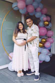 I loved this dress - wore it for my gender reveal party and got so many compliments! It was a bit loose around the chest, so I'd recommend sizing down if you're between sizes. Otherwise, it's a beautiful and flattering piece! - Akshata K.