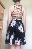 This dress is so cute. Probably better for people with small busts because it is quite tight in the top half. Other than that, it fits perfectly and is long enough to cover my bottom which is sometimes hard to find. - Brandi H.