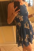 This dress is adorable. Good quality fabric and nicely made. I was skeptical at first but read the reviews and I ended ordering a medium and it fits perfectly. I have a boxy shape and am pretty flat chested so I am able to go without a bra while wearing the dress with no worry when I get cold! The straps in the back can adjust a little bit to give room for bigger boobs. - Michelle H.