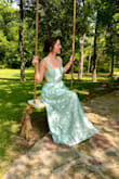 This dress was amazing, I got so many compliments. I love the bow in the back because you can tie it to fit your body. Totally recommend this. I ordered it in Large and it was too big, the medium fit me perfectly. The material was great too. - Kathleen R.
