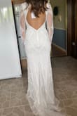 I couldn't be happier with my wedding dress! It fits like it was custom-made for me, absolutely perfect in every way. The quality is far beyond what I expected for the price. The fabric feels luxurious, the stitching is flawless, and the overall design is stunning. I've tried on dresses that were triple the cost and didn't come close to how beautiful and well-made this one is. Highly recommend to any bride looking for elegance without breaking the bank! - Elena B.