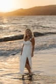 I used this dress for our day-before photoshoot for our elopement. It was perfect! So comfortable and photographed so well! Love the slit and the movement of the sleeves! I ordered my normal size (M) and it fit great. - Danielle K.