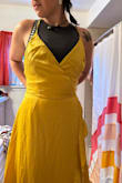 I ordered a large. My daughter, who weighs 125lbs 5foot 2 in, and has a 26-inch waist, could fit in the dress. The top was too large, but the waist fit her well. - Lara O.