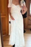 I tried this dress on and loved it immediately. The quality feels great, and the fabric and design are beautiful. I love that the size is adjustable, thanks to the strappy back. I was looking for something playful yet modest for my wedding reception with my fiancé's family, and this fits the bill. - Tanya A.