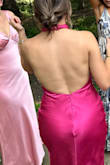 I bought this dress for an all-pink bridal party and LOVED it! It fits really well and is very flattering. The twist neck is fun and the length and slit are ideal. Would def buy again. - Rhetta E.