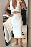 Bought this dress for a Greece vacation! I was worried it may be too tight and hard to wear, but it is almost a smidge too big but not enough to size down! Very easy to wear! - Samantha L.
