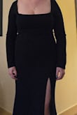Material is heavy and sucks you in. The square neckline is low - I needed to use shape tape to make sure things stayed in place. Slit is high, hit mid thigh.  Love this dress. With minor alterations, I plan to wear it again in the future. - Samantha M.