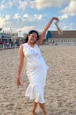 The dress was very well made and thick, but I was able to wear it to the beach. I usually am in between a medium and large, but decided to go with large, and it was perfect! - Merlyn T.