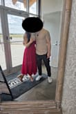 Anytime I wear it, I get a million compliments. It is very, very long (I'm 5'3'' and even with 3'' heels, it was hitting the floor). I got 11 inches taken off of it, which is a huge amount, but it turned it into the perfect midi dress for me. The first photo was before hemming it, and the second is afterwards - Ria E.