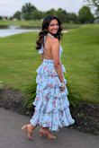The frills are fun and bouncy, and the band around the back is stretchy. Ordered a M and it was a touch big, requiring some alteration to make it tighter (am a size 4-6). No bra required! - Megha C.