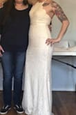 Wore this dress for my wedding! It was absolutely beautiful and I received so many compliments! The dress fit great, it was a little long but with my heels it was perfect. The only complaint I have is that the zipper stuck out a little from too much bunches up fabric. I took it to the tailor and it was an instant fix and looked perfect! - Sarah H.