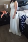 I was so excited when I tried this dress on. It's beautiful and perfect for my intimate outdoor wedding. I love the top and the bottom section falls beautifully. I will have to get mine altered, it's a little too long. - Stephanie F.