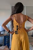 The outfit was true to size and looks very flattering. I got the yellow color, and I love how flowy it looks. The slits on the side do open up quite a bit but you could use a safety pin to hold it in place. The two things I didn't like were that it's see through - you can clearly see panty lines, and the material crushes easily. - Amrita S.