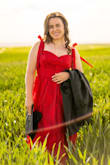 The red was a bit lighter than it appeared on the model, but still a true red- not pink. The tie-up straps were such a cute detail, and the dress photographs really well. The waist was a little loose, but the elastic back helped somewhat. If I'd had more time, I probably could've taken it in. The length was slightly long for graduation regalia, but I personally didn't mind. Overall, would recommend! - Janelle G.