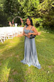 The dress runs a little tight under the chest area and very long. I am 5'3 and I was wearing 3.5" heels and the dress still dragged on the ground. 
Overall, I like it and would have purchased the next size up. I ordered a medium. - Grace L.