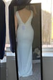 Long for 5ft4 (164cm) and the area around the bust is very loose. The straps kept falling down on me. But if I sized down, it would be too tight around the waist. So I had it tailored to fit more around the bust and hem it shorter. Perfect for a simple courthouse wedding or outdoor bridal shooting/events. Classic and elegant on an hourglass body - Heather D.