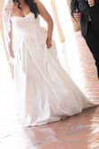 I used this as my elopement wedding dress, and it was gorgeous! No one tells you that wedding dress sizes can be a mood killer, because even at size 10, I felt snug but nonetheless super beautiful. The dress photographs well and the slit it sexy but also the style of the dress is so classy. - Areli T.