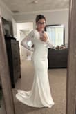 The dress is absolutely gorgeous. It fit perfectly in all the right places. Will need to get altered on the sides around the open back section, but that's ok! Seriously can't wait to get married just to put it on again! - Laurelis M.