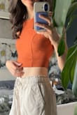 I loved the fit of this crop top! It is definitely quite cropped, especially as a tall girl. But I am still in love with it and the color. There is a slight "gap" in the back when I stand a certain way, but personally, it does not bother me and still looks like it fits well. - Alexis W.