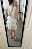 Got this dress for my bridal shower and it is so so cute. It looks exactly like the photo. The armpit area has a bit of a gap so I will just wear stickies because a bra would show on the sides on me (you do need a bra with this dress in my opinion.) I think it's really unique and pretty. I gave it a 4/5 because I can't say it's the most comfortable dress ever but would still recommend. :) - Alison M.