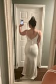 My husband and I decided to elope after 10 years of being together. I ordered this dress a little more than a week before our elopement, and it ended up coming the day before. I tried the medium on and immediately fell in love. The fit of the dress and the length was everything I was looking for. The ONLY down side, are the straps. If you need them much tighter like I did, they will be visible if you have short hair. My husband loved it and our girls loved it too. I had some oddly made spanx on underneath so that's what that line is across the butt. - Moriah W.