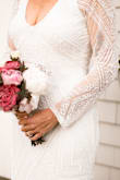 I wore this as my wedding dress earlier this month and absolutely loved it!  This was a second wedding, so I was apprehensive about anything too "bridal" but also wanted to be special.  This was better than I could have imagined!   It is fully lined and even though it is fitted, it is forgiving and very comfortable. - Laura A.
