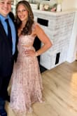 I wore this dress this past weekend to a wedding as a guest, and I've never gotten so many compliments! The waist has no stretch and zippers up, but a medium fit me perfectly. The straps are adjustable, and you can tie the back as loose or tight as you need to, which is nice. The only con is it was a bit long, even with heels, so I did have to keep picking it up when I walked, so I didn't get it dirty/step on it. Overall, one of my favorite dresses I've owned! So beautiful and feminine. I felt like a princess wearing it! - Hayley C.
